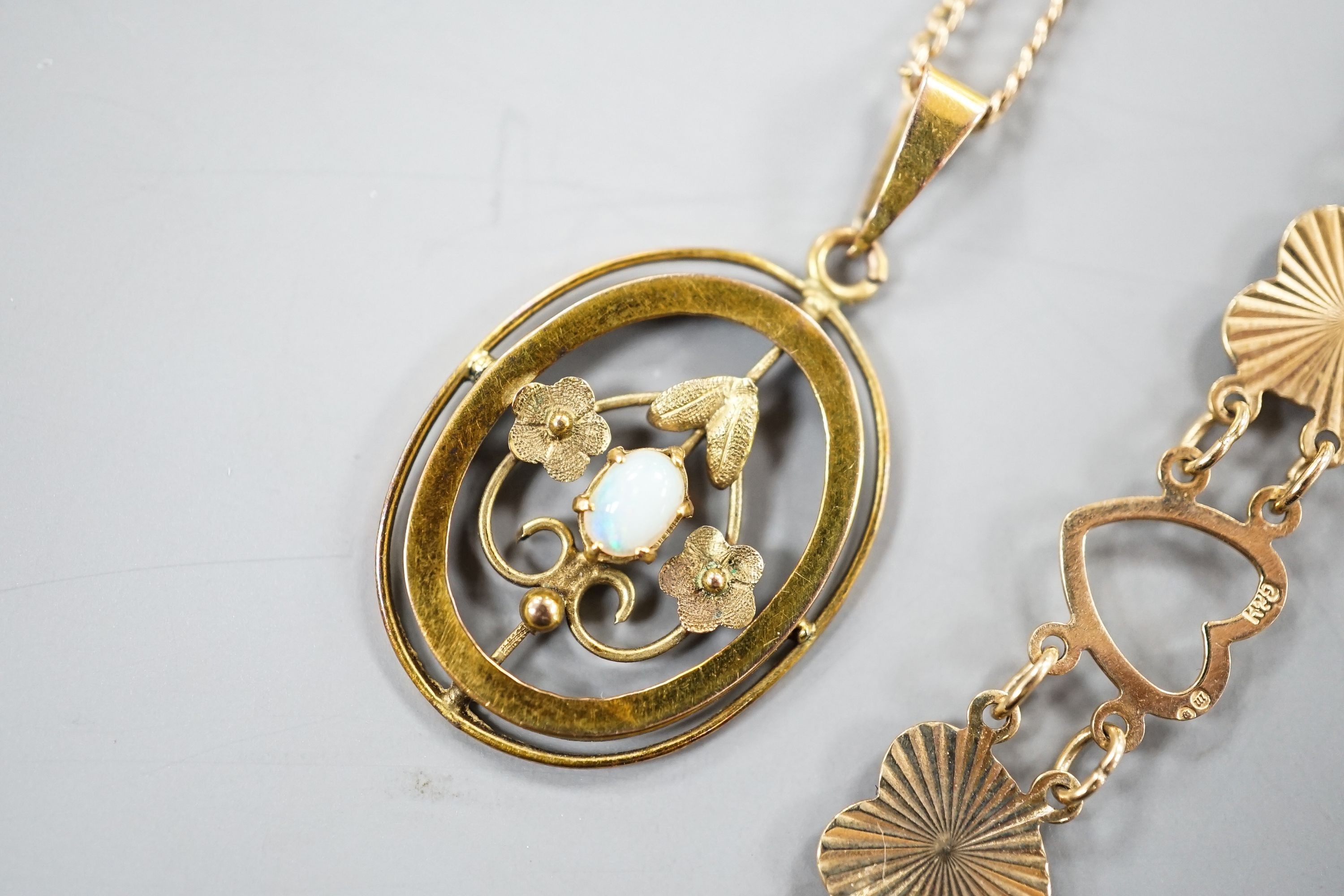 A 9ct and heart shaped link bracelet, 18cm and a yellow metal and opal pendant on a yellow metal chain